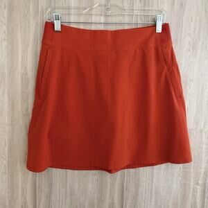 ATHLETA Action Skort Size 8 Dobby Orange Pockets Stretch Athletic Skirt Golf